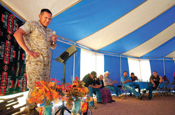 Dustin Francisco shares memories from his combat deployments in the Marine Corps with family and friends at a welcome home celebration in Thoreau on Tuesday. &copy; 2011 Gallup Independent / Adron Gardner 
